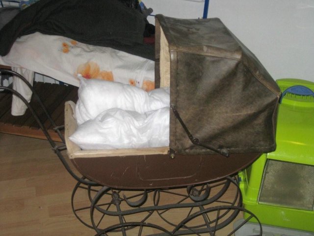 Antieke poppenwagen